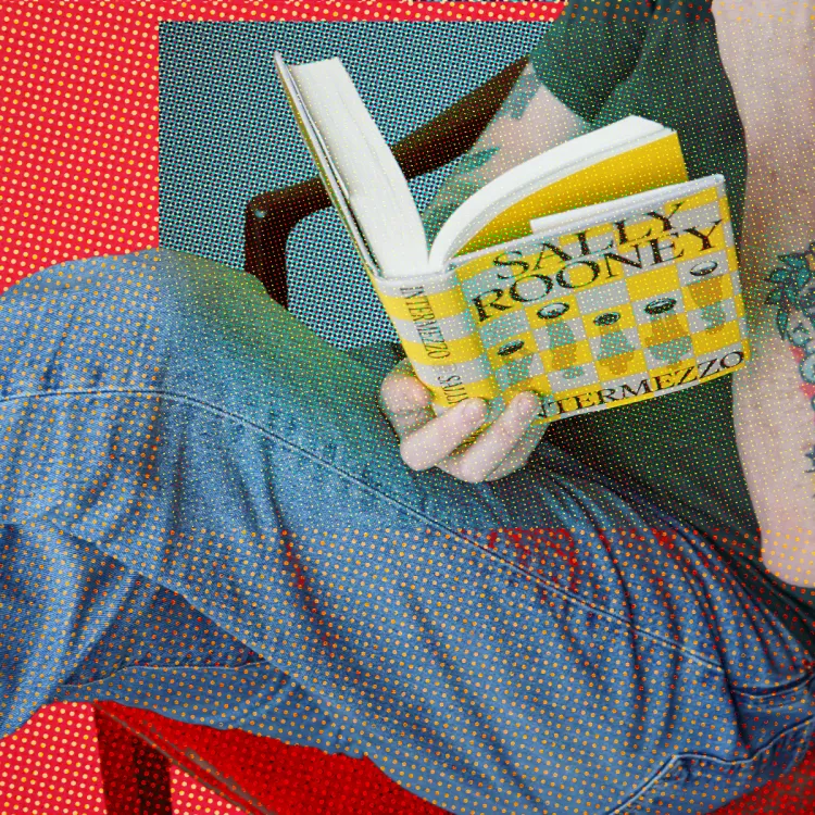 Man lounges reading Sally Rooney's book Intermezzo