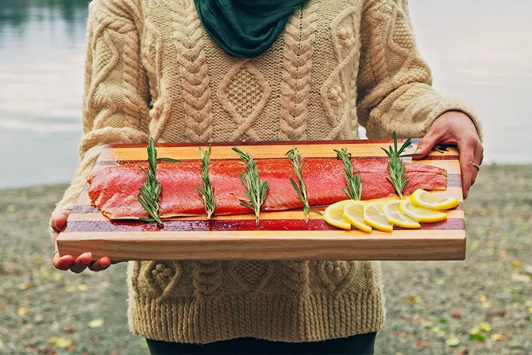 person holding prepared salmon lifestyle image
